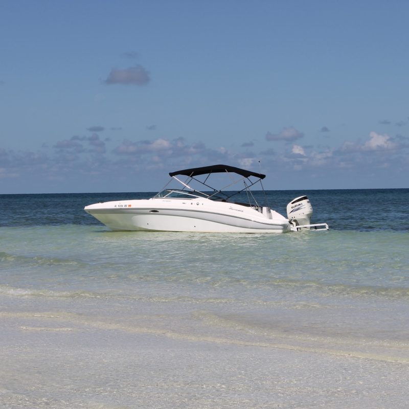 a man flying through the air while riding a wave in the ocean